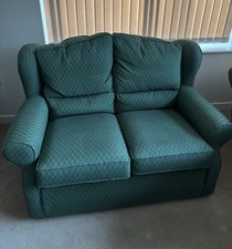 A Three-Piece Suite Comprising Two Seater Sofa and Two Wingback Open Armchairs