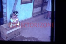 35mm Slide girl playing in old