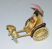 JAPANESE MAN PULLING LADY WITH