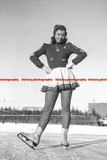 F003220 Ice skater posing in typical 1940s outfit