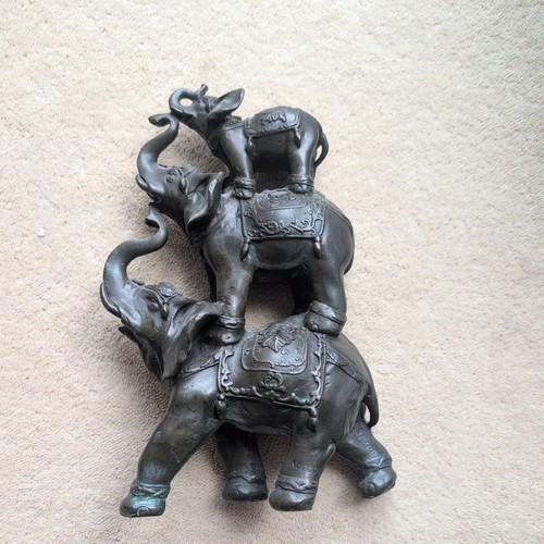 Three stacked elephants - three,