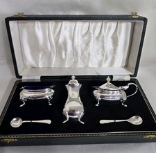 Sterling silver Five piece cruet set. Birmingham 1957. By Adie Brothers Ltd 