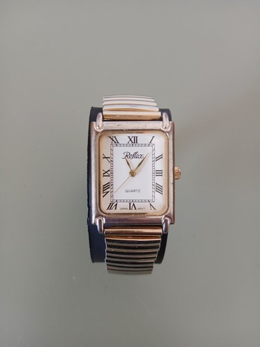 Reflex gold tone watch with
