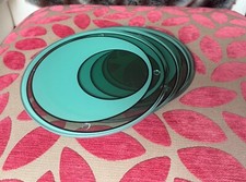 Set of four jade glass vintage John Lewis circular place mats, boxed