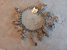 925 Sterling Silver Vintage 1973 Charm Bracelet 12 Charms with safety chain 59g