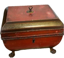 Antique Metal tea caddy,” vintage red tin box claw feet,"or "Victorian tea caddy
