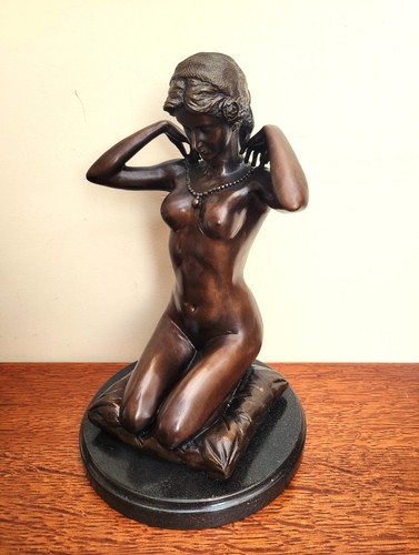Bronze figure kneeling - a,