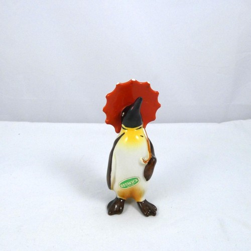 Beswick penguin holding - beswick,