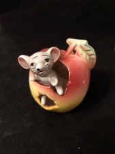 Vintage ceramic mouse in apple