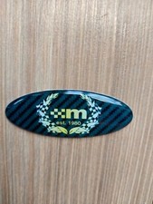 Steering wheel dome badge