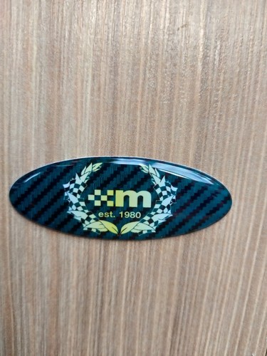 Steering wheel dome badge