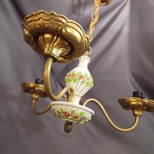 Lovely unusual Louis XV three arm chandelier. Brass with porcelain centrepiece.