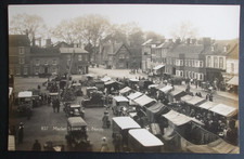 Old Cambridgeshire RPPC MARKET SQUARE ST NEOTS STALLS FIREMAN LADDER ICES SHOPS