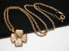 Signed Fossil Luck four leaf clover necklace in rose gold steel