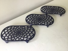 Three vintage large cast iron blue oval trivets hot plates flower pot stands