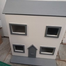Vintage wooden dollhouse with