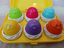 TOMY Hide & Squeak Egg Box
