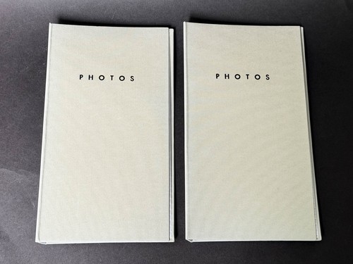 Two flip photo albums - -, each