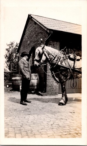 Old photo man in - b&w, stable