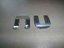 Retaining plate hose holder