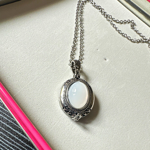 Silver tone oval photo locket - photo,