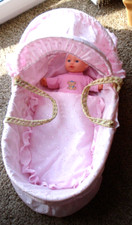 pink dolls moses basket with covers and dressed doll