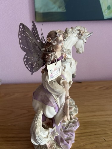 Fairy riding unicorn statue - a,