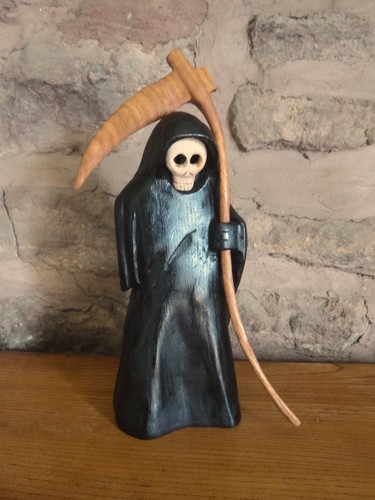 Carved wooden grim - carved,