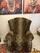 Wing back Leopard Print Arm Chair With Wooden Legs And Gold Wheels