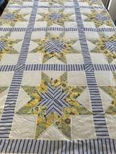 Antique quilt with yellow flowers