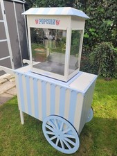 commercial popcorn machine including custom made striped hand cart with storage