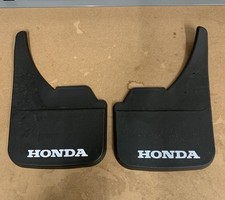 Set of 4 Honda Mud Flaps.  See photos.  Missing Screws.  NEW NOT USED