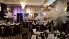 Black Stretch Chair Covers Weddings / Events, Ostrich Feather Centerpieces. HIRE