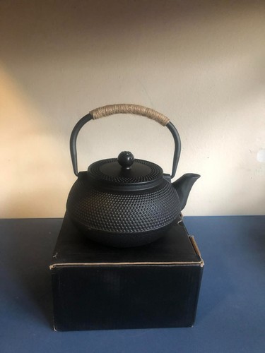 Cast iron kettle with tea - kettle,