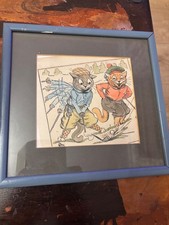 A framed Louis Wain print of cats playing golf