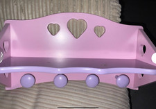 Girls wall shelf with hanging pegs 