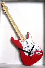 GUITAR,RED,STRATOCAS,WALL