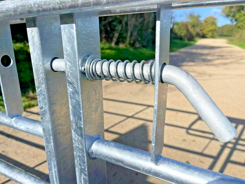 Spring slide bolt for metal