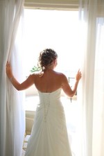 Size 10, ivory wedding dress, corset back, hook to lift trail up.needs drycleani