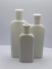 3 old white milk glass bottles
