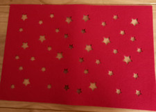 4 thick red felt placemats with cutout stars