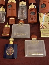 Collection Of Used Empty Yves St Laurent Opium Perfume Bottles. 