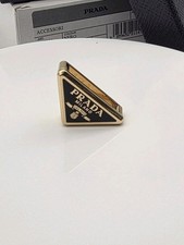 Prada gold black triangular