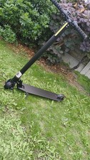 Black Electric Foldable scooter with kickstand. FAULTY NEEDS BATTERY REPLACEMENT
