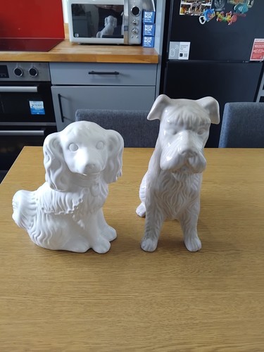 Pair white ceramic dog - of,