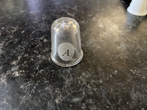 Glass thimble eith letter - letter, on