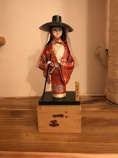 Japanese Geisha Doll On Wood