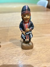 hand-carved wooden figure, identified as a traditional Sami handicraft item