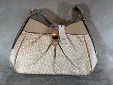 River Island beige RI monogram print jacquard slouch bag.