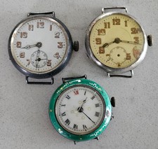 LOT OF ANTIQUE SILVER AND NICKLE CASED TRENCH TYPE WATCHES FOR SPARES OR REPAIR.